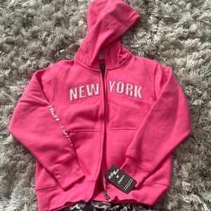 Brand new girls large zip up hoodie.